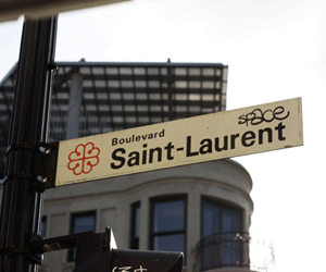 a street sign with a building in the background